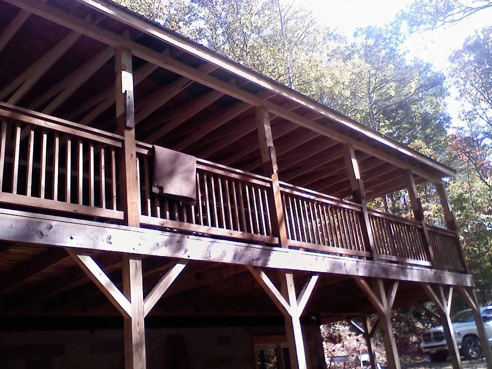 Timber framing under a new elevated porch and deck — Roof Leak Repair in Fresno by Roofing Brothers