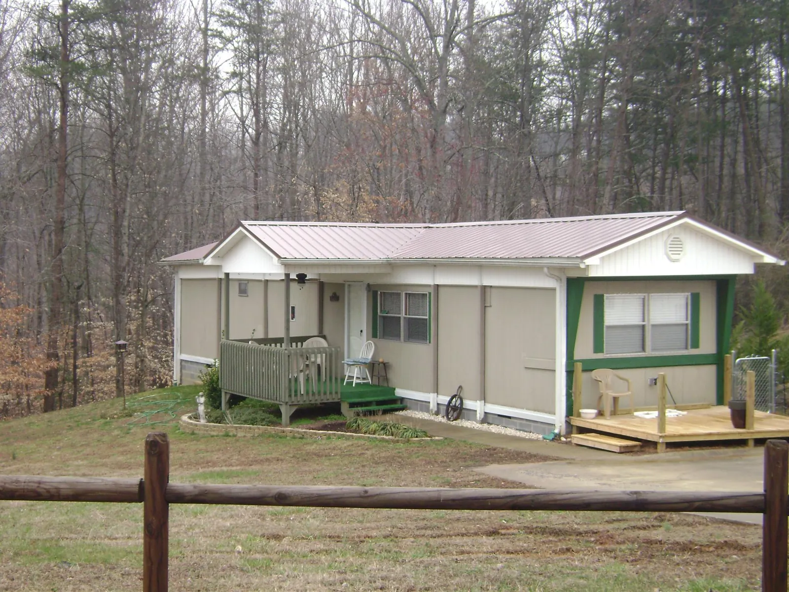 Mauve metal roof on a manufactured home with a new front deck in Fresno